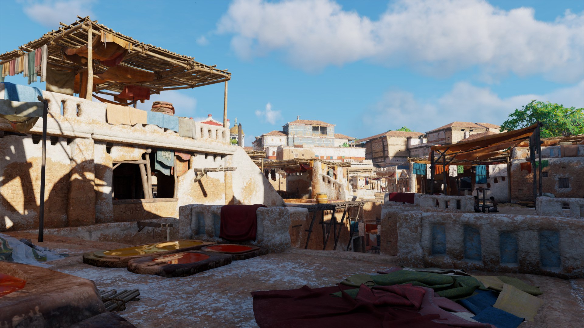 Ob dreckige Wäsche, spielende Kinder oder eine Färberei auf dem Dach: Oft sind die alltäglichen Szenen in Alexandria die, die am meisten faszinieren (Quelle: Assassin Creed: Origins, Ubisoft)